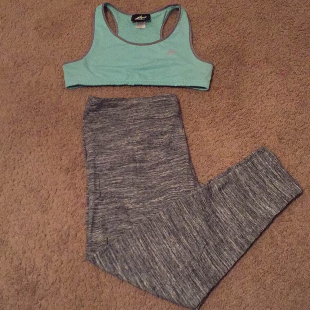 A sports bra with striped exercising leggings.